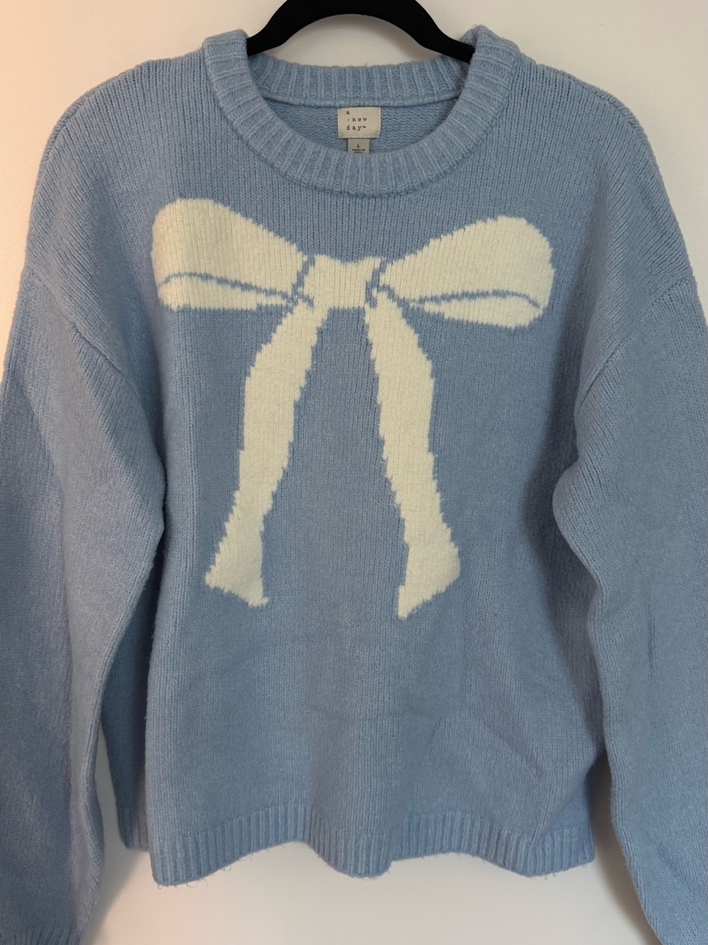 a new day Light Blue Crewneck Sweater with White Bow Intarsia
